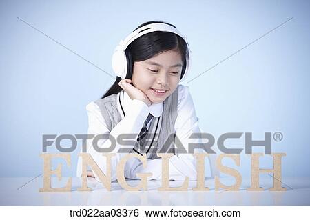 a student with a block of words saying English View Large Photo Image Stock Photograph - a student with a block of words saying English. Fotosearch