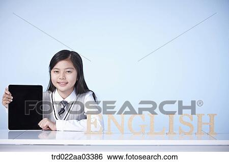 a student with a block of words saying English View Large Photo Image Stock Photograph - a student with a block of words saying English. Fotosearch