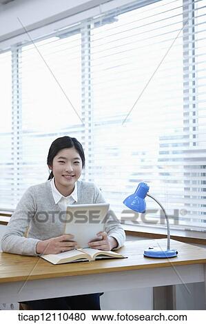 a student with tablet PC at table View Large Photo Image Stock Image - a student with tablet PC at table. Fotosearch