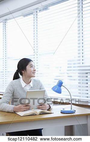 a student with tablet PC at table View Large Photo Image Stock Image - a student with tablet PC at table. Fotosearch
