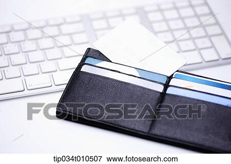 a wallet on a keyboard View Large Photo Image Stock Photo - a wallet on a keyboard. Fotosearch