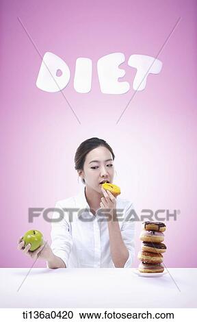 a woman eating diet food View Large Photo Image Stock Image - a woman eating diet food. Fotosearch
