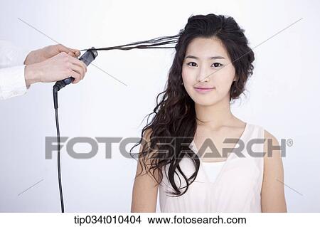 a woman getting hair done View Large Photo Image Picture - a woman getting hair done. Fotosearch
