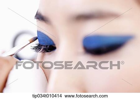 a woman getting professional make up View Large Photo Image Picture - a woman getting professional make up. Fotosearch
