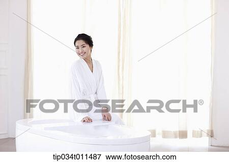 a woman in bathrobe sitting on a Jacuzzi View Large Photo Image Stock Photo - a woman in bathrobe sitting on a Jacuzzi. Fotosearch