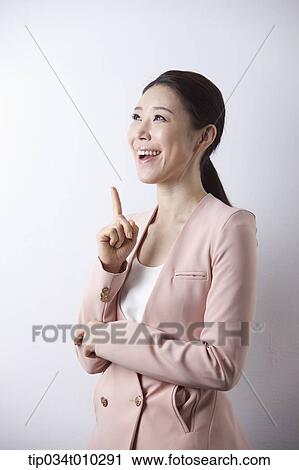 a woman in business suit looking excited View Large Photo Image Stock Image - a woman in business suit looking excited. Fotosearch