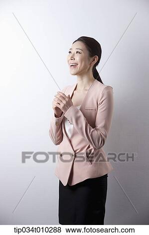 a woman in business suit looking excited View Large Photo Image Stock Photo - a woman in business suit looking excited. Fotosearch