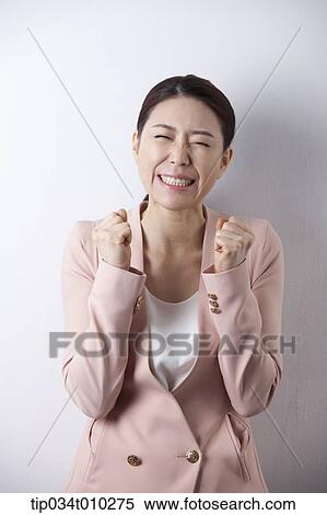 Stock Photography - a woman in business suit looking stressed. Fotosearch