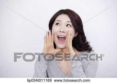 a woman in grey plain shirt shouting View Large Photo Image Stock Photo - a woman in grey plain shirt shouting. Fotosearch