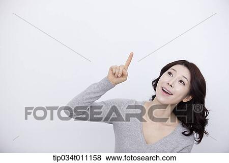a woman in grey plain shirt smiling View Large Photo Image Stock Photo - a woman in grey plain shirt smiling. Fotosearch