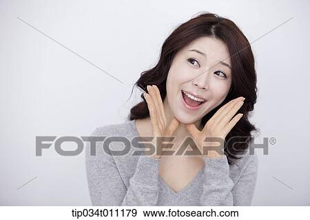 a woman in grey plain shirt smiling View Large Photo Image Stock Photo - a woman in grey plain shirt smiling. Fotosearch