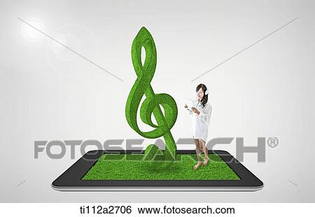 Stock Photograph - a woman on tablet PC with music note. Fotosearch