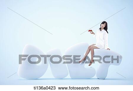 a woman sitting on the word diet View Large Photo Image Stock Image - a woman sitting on the word diet. Fotosearch
