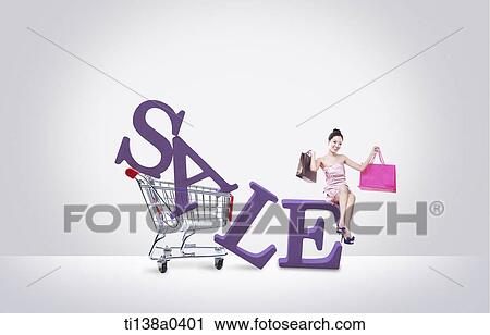Stock Image - a woman sitting on the word sale. Fotosearch