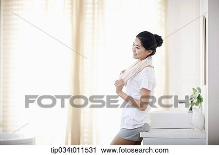a woman with a towel around the neck View Large Photo Image Stock Image - a woman with a towel around the neck. Fotosearch