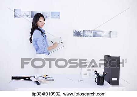 Stock Image - an interior designer sketching. Fotosearch