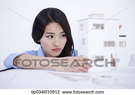 an interior designer with a model house View Large Photo Image Stock Image - an interior designer with a model house. Fotosearch