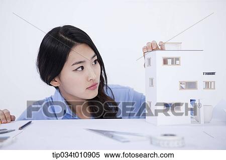 an interior designer with a model house View Large Photo Image Stock Photography - an interior designer with a model house. Fotosearch