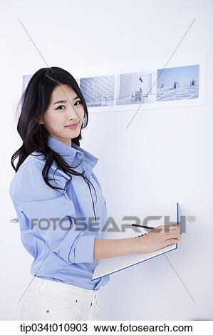 an interior designer with a sketch book View Large Photo Image Stock Image - an interior designer with a sketch book. Fotosearch