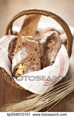Stock Image - baked bread on a basket. Fotosearch