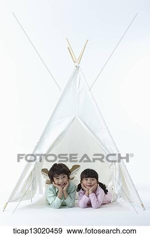 Stock Photo - brother and sister in a tent. Fotosearch