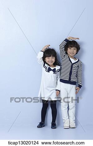 Picture - brother and sister together. Fotosearch