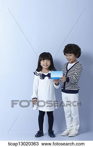 Stock Image - brother and sister with a bankbook. Fotosearch