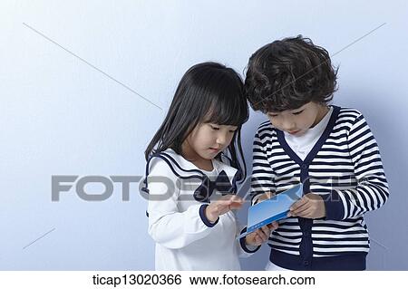 Stock Photograph - brother and sister with a bankbook. Fotosearch