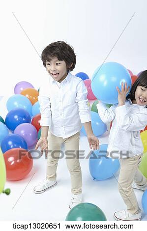 brother and sister with a lot of balloons View Large Photo Image Stock Image - brother and sister with a lot of balloons. Fotosearch