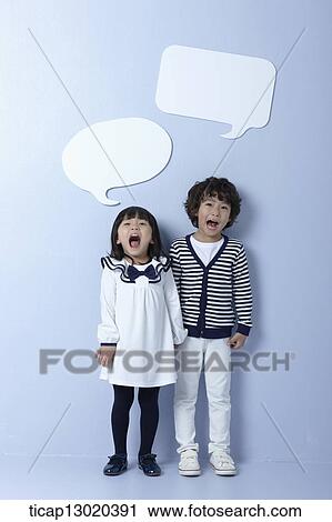 Stock Image - brother and sister with empty speech bubbles. Fotosearch