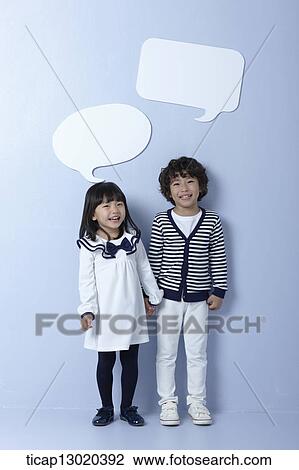 Stock Image - brother and sister with empty speech bubbles. Fotosearch