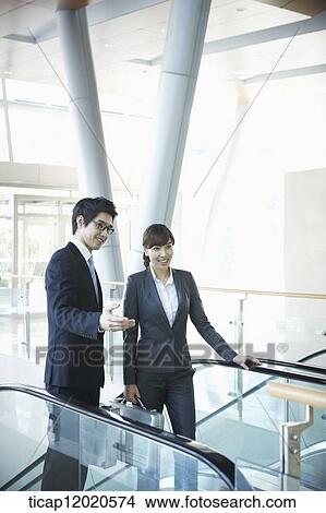 Picture - business people going up the stairs. Fotosearch