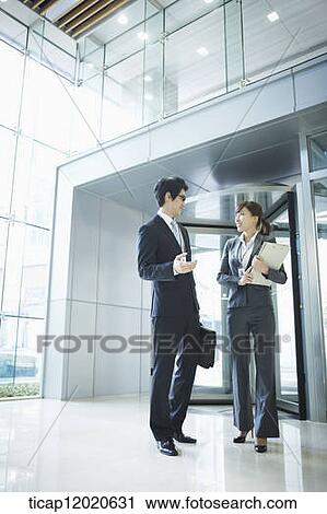 business people standing in the door way View Large Photo Image Stock Image - business people standing in the door way. Fotosearch