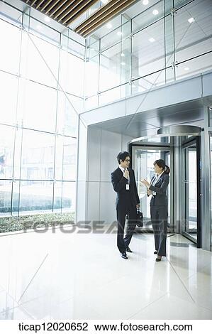 business people standing in the door way View Large Photo Image Stock Image - business people standing in the door way. Fotosearch