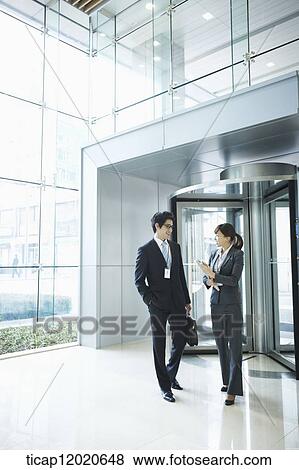 business people standing in the door way View Large Photo Image Stock Photo - business people standing in the door way. Fotosearch
