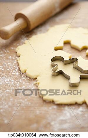 Picture - cinnamon bread in shape of ginger man. Fotosearch