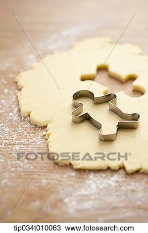 Stock Image - cinnamon bread in shape of ginger man. Fotosearch