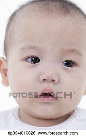 Stock Photograph - close of a baby after crying. Fotosearch