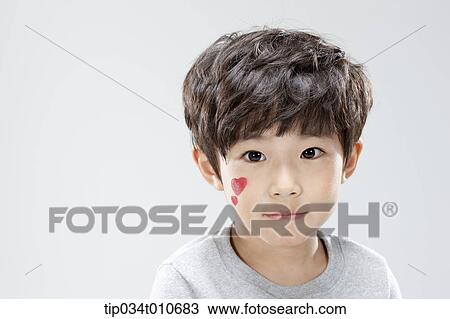 Stock Image - close up of a boy with face paint. Fotosearch