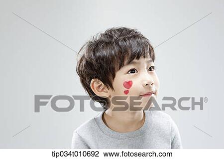 Stock Image - close up of a boy with face paint. Fotosearch