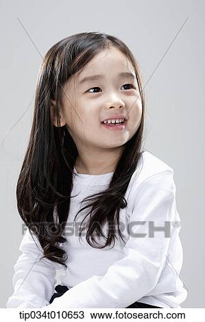 Stock Image - close up of a girl smiling. Fotosearch