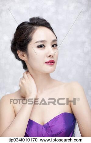 close up of a woman in purple dress posing gracefully View Large Photo Image Stock Image - close up of a woman in purple dress posing gracefully . Fotosearch