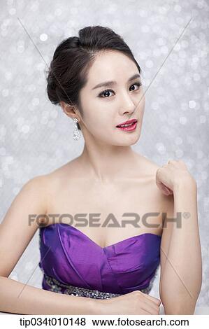 close up of a woman in purple dress posing gracefully View Large Photo Image Stock Photo - close up of a woman in purple dress posing gracefully . Fotosearch