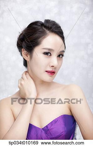 close up of a woman in purple dress posing gracefully View Large Photo Image Stock Photo - close up of a woman in purple dress posing gracefully . Fotosearch