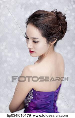 close up of a woman in purple dress posing gracefully View Large Photo Image Stock Photo - close up of a woman in purple dress posing gracefully . Fotosearch