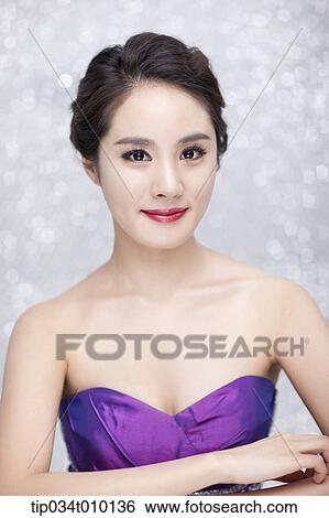 close up of a woman in purple dress posing gracefully View Large Photo Image Stock Photograph - close up of a woman in purple dress posing gracefully . Fotosearch
