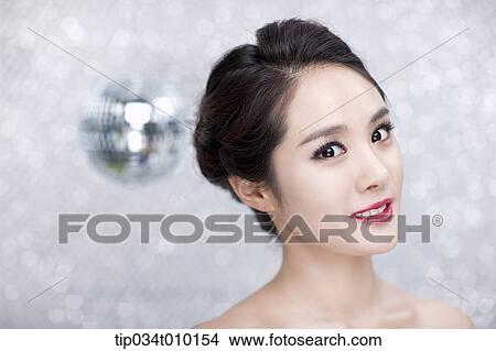 close up of a woman posing gracefully View Large Photo Image Picture - close up of a woman posing gracefully . Fotosearch