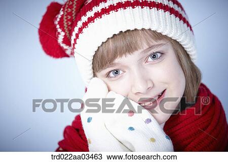 Stock Image - close up shot of a girl in winter outfit posing. Fotosearch