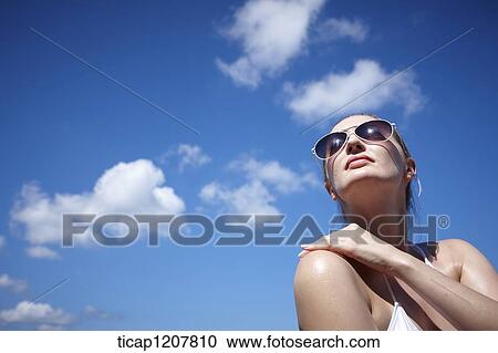 close up shot of a lady in sunglasses and bikini View Large Photo Image Stock Image - close up shot of a lady in sunglasses and bikini. Fotosearch