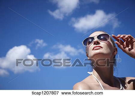 close up shot of a lady in sunglasses and bikini View Large Photo Image Stock Photo - close up shot of a lady in sunglasses and bikini. Fotosearch